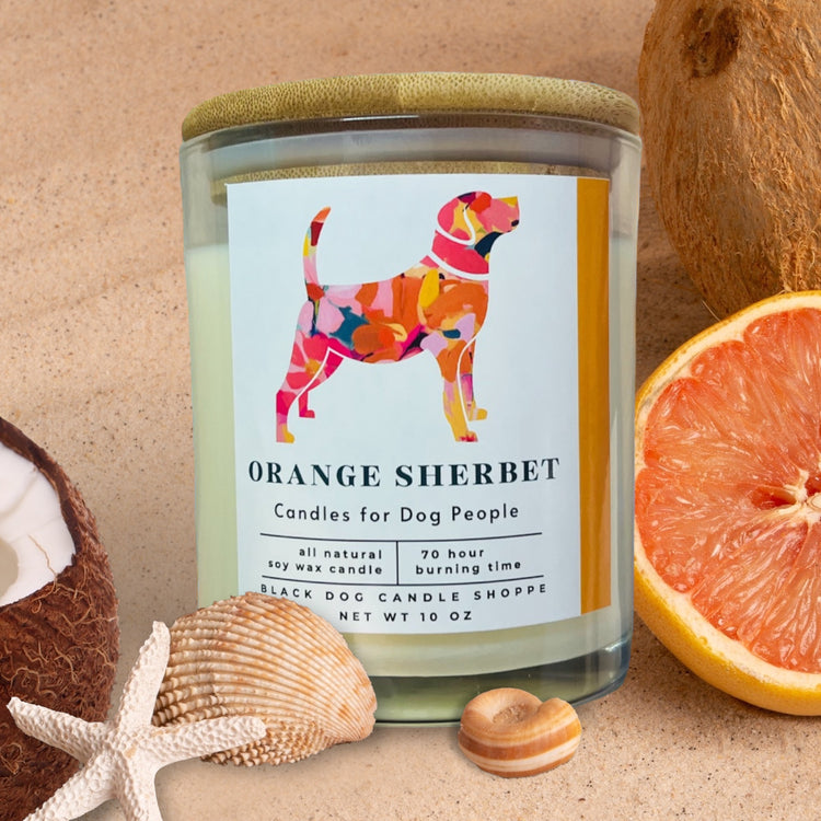 clear candle in orange sherbet scent. Colorful dog silhouette