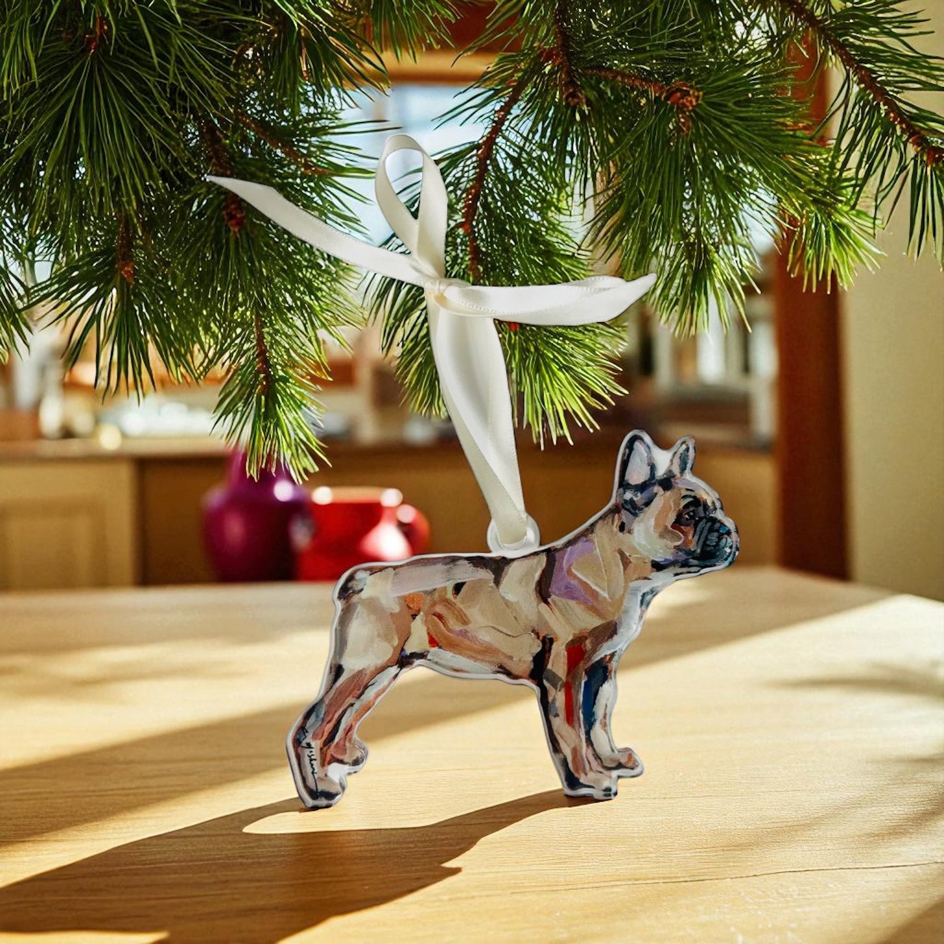 french bull Dog-shaped ornament hanging on a Christmas tree branch