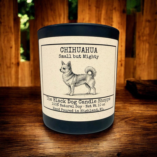 Chihuahua soy candle in matte black jar with bamboo lid, featuring vintage dog illustration and “Small but Mighty” label on rustic wood background