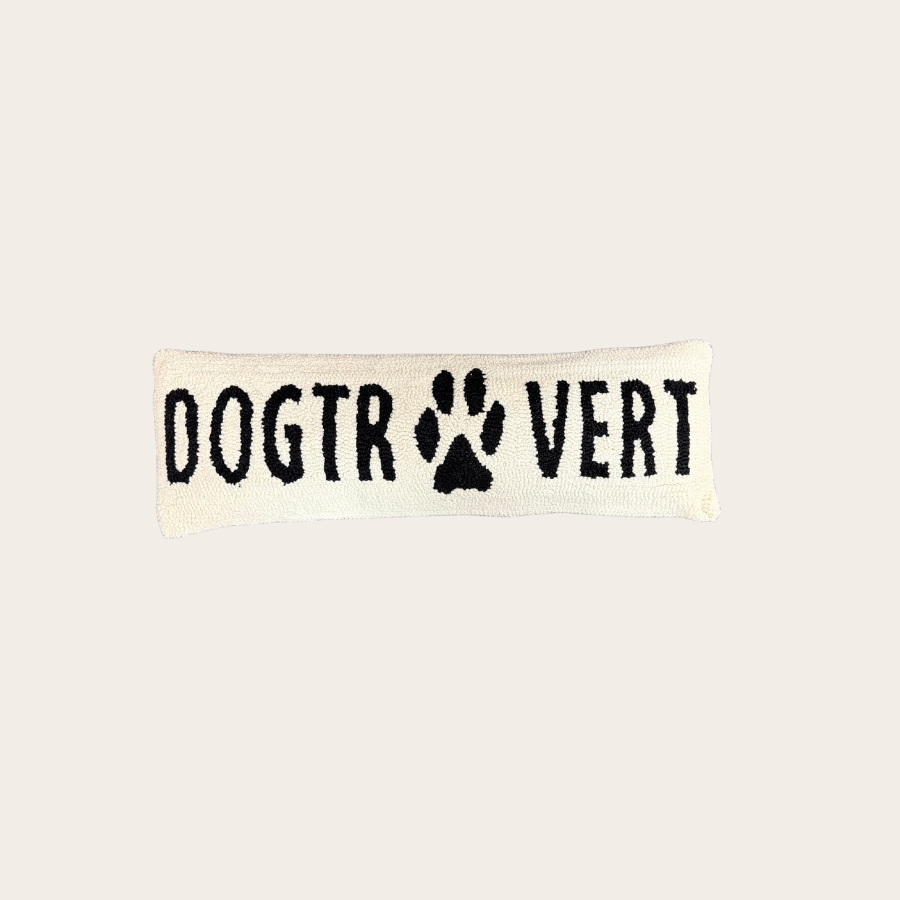 Neutral textured throw pillow with “Dogtrovert” text and paw print design, minimalist dog lover accent pillow on clean background