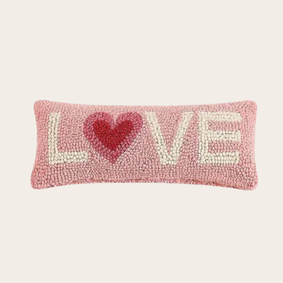Pink textured accent pillow with LOVE lettering and red heart design, soft decorative throw pillow for cozy home decor