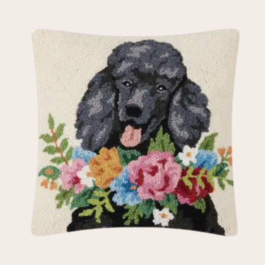 Decorative throw pillow featuring black poodle with colorful floral arrangement, textured dog lover accent pillow on neutral background